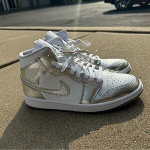 Woman’s white metallic air Jordan 1